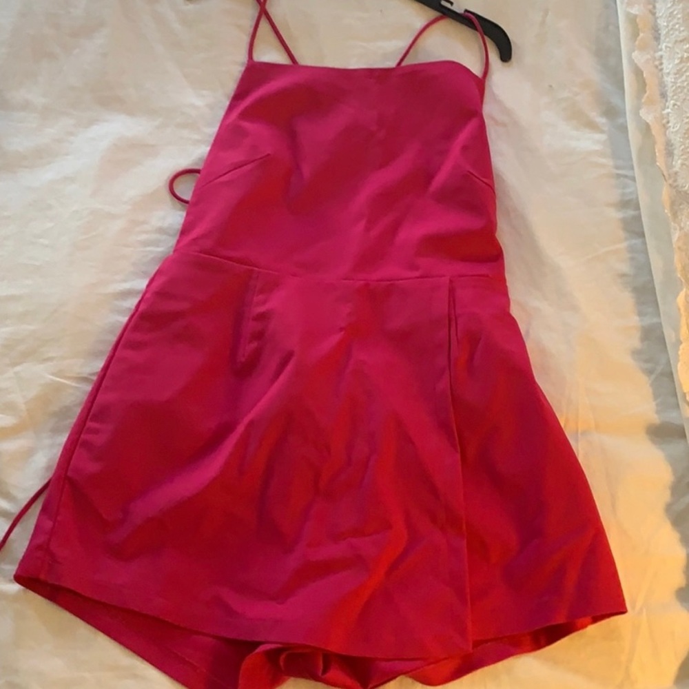 Pink revolve romper